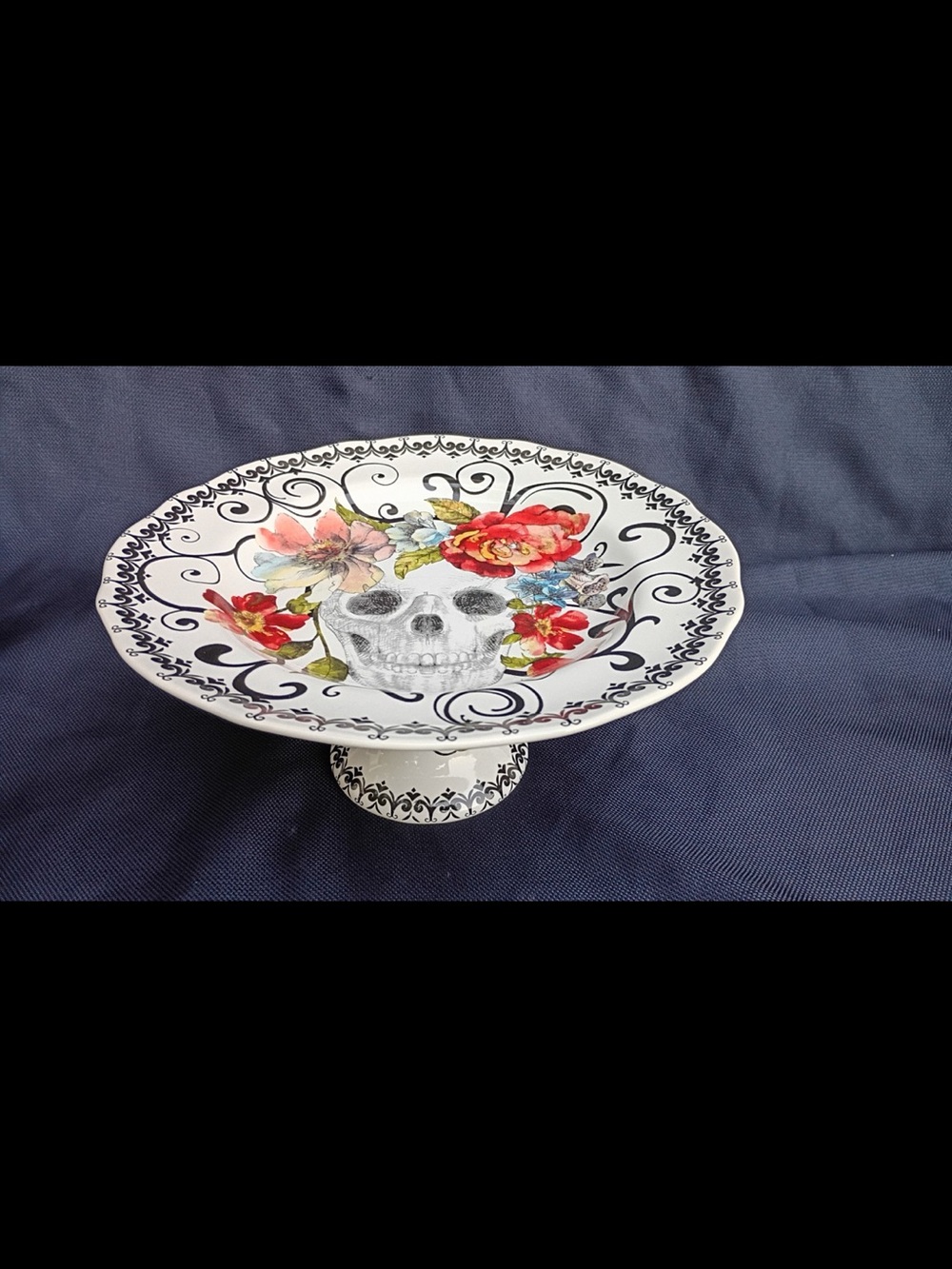 222 Fifth White Ceramic Pedestal Plate with Red Floral Skull